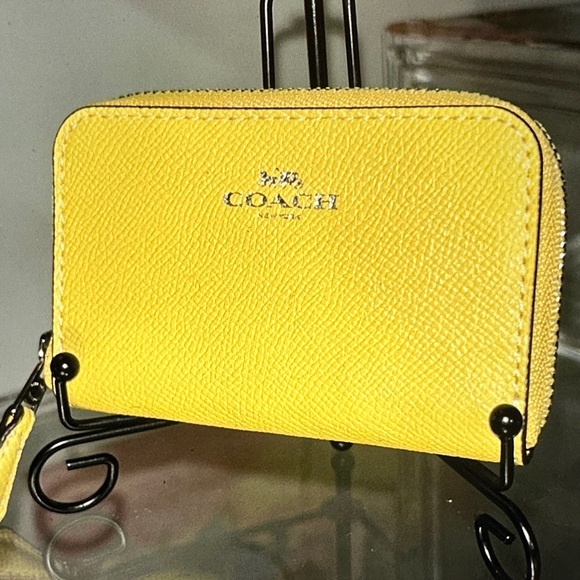Coach Handbags - Coach Vibrant Yellow Zip wallet